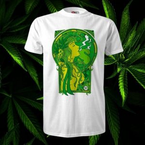 White T-shirt with a green Art Nouveau-style illustration of a reclining woman inside an arched frame, flowing hair and smoke at her lips.